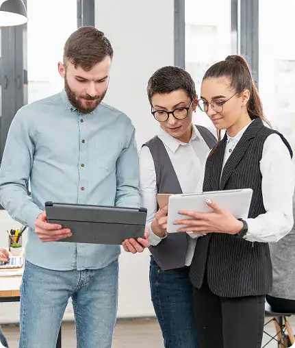 Business team collaborating with tablets in modern office.