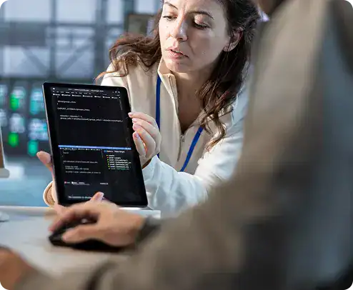 i3solutions Tech Support Woman using a tablet for tech support and coding at work.