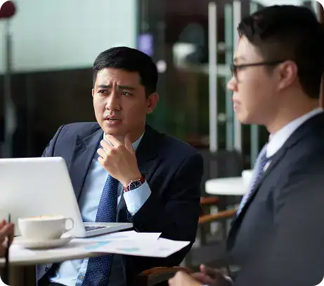 Business professionals engaged in a serious discussion during a corporate meeting.