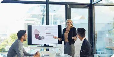 Business team discussing strategies in a modern office setting.