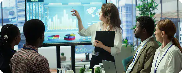 Business team discussing data analytics in a modern office setting.