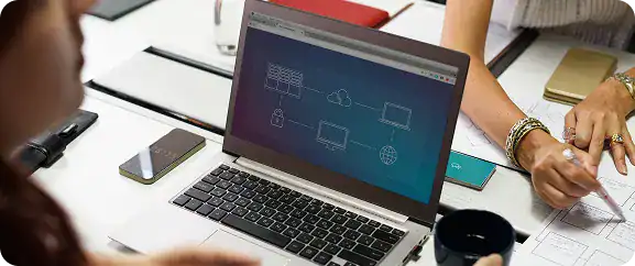 Modern workspace with laptops and digital devices for business efficiency.