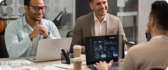 Business team collaborating during a meeting at i3solutions office.